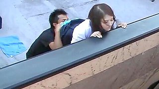 Hot Asian doll and guy are fucking on the roof