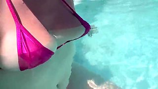 Artemisia Love dressed in a wondrous bathing suit in the outdoor jacuzzi