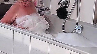 Mature Tgirl Stroking Throbbing Cock in Bubbly Tub Climax