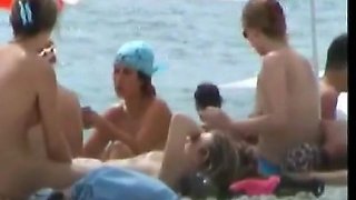 Horny voyeur loves to spy on nude people on the beach.