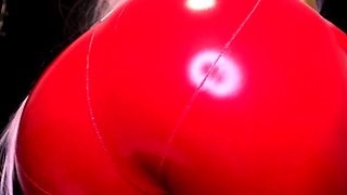 Femdom MILF vixen in red latex bodysuit plays with herself