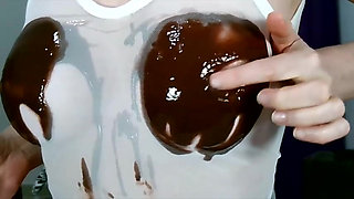 Wetting boobs, tities and nipples with chocolate