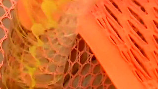 Glass Dildo Solo in an Orange Fishnet Bodysuit - Busty Brunette Plays on the Couch