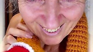 An Old Woman Flirts in the Kitchen While Taking off Her Clothes