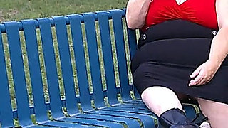 Nurse Vicki Smoking in the Park on a Bench All Dressed up