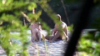 Voyeur captures amateur couple having sex on the beach