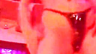 Blonde Stripper Bends Showing Shaved Pussy