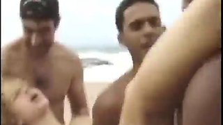 Beautiful and hot blonde with a big ass moaning and cumming, giving her pussy and very tasty spit in a gang bang on the beach: Porn