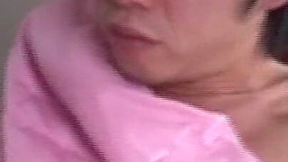 Mature Brunette in Pink Costume Takes Massive Facial