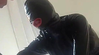 Laura is wearing a condom latex catsuit and high heels, roughly fucked and throatfucked