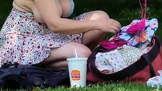 Blonde is flashing her big boobs in the outdoors