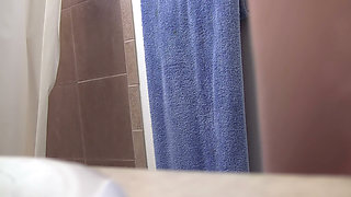 Busty Redhead in Glasses Films Herself Naked in the Bathroom Mirror