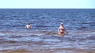 Funny Stepmommy Has Fun on the Beach with Young Guys