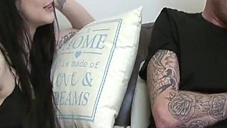 Tattooed Brunette Gets Fingered on the Couch and Cums Hard