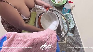 Indian Desi Bhabhi Was Working in the Kitchen Washing Dishes and Showing Her Big Boobs