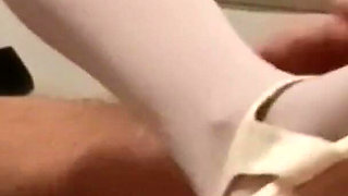 MILF in Pantyhose and Heels Gives a Footjob