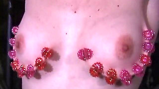 Milf gets strawberry round her tits while gagged and on bondage