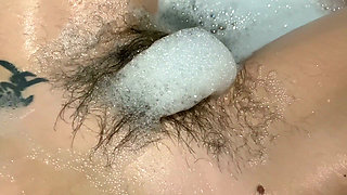 Hairy bush underwater in the bathtub