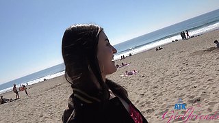 A girl was having fun on the beach with her friend.