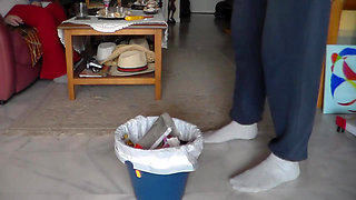 John is peeing all in the trashcan