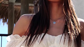 Asian MILF cowgirl poses nude at a ranch