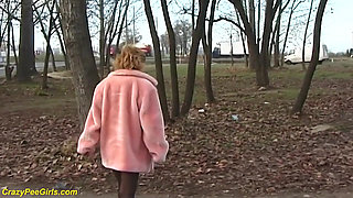 Redhead wife pissing in outdoor