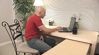 Bald dude in front of the computer