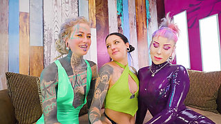 Two dominas gang up on Goth chick to fill her holes with toys and make her cum