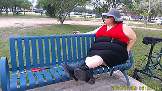 Nurse Vicki Smoking in the Park on a Bench All Dressed up
