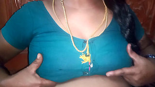 Tamil aunty squeezing her breasts when she is alone and unable to control her emotions.