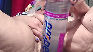 Big Bottle Plugged Clit Cunt