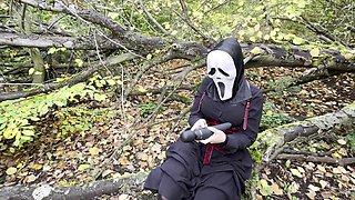 Hot girl with big boobs, wearing ghostface mask has a wild sex with her boyfriend in the forest