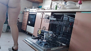 Sexy nude wife preparing food in the kitchen. Hairy brown hair, big ass, big tits.