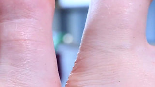 Redhead Rubbing Her Own Aching Feet
