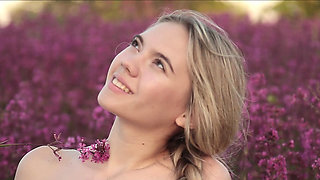 Cutie shows off her body in a flower field