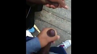 Black amateurs stroke big cocks outdoors