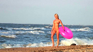 Hot naked blonde on the beach