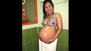 8 months pregnant Thai MILF amateur jerking off her husband