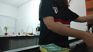 Woman teasing while washing dishes. She loves to transmit to the voyeurs on duty