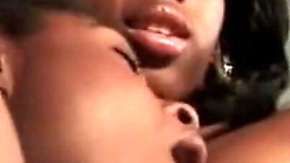 Two Young Black Lesbians with Nice Tits Lick Each Other's Pussy and Enjoy