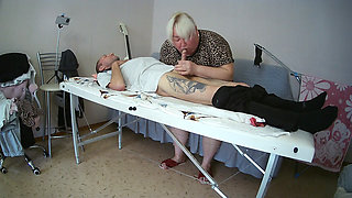 Mother-in-law sucks and jerks off my dick on the massage table and swallows cum