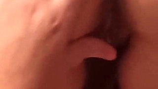 Inserted an anal plug and a finger into it