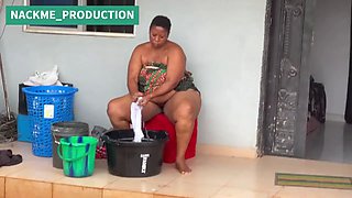 African Mama Multitasks on a Sunday Morning