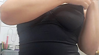 showing off her breasts and a little more of mom's