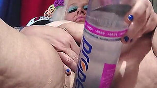 Big Bottle Plugged Clit Cunt