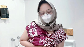 Fountain of a girl in a batik daster dress