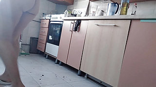 Sexy naked wife preparing food in the kitchen. Hairy brunette, big ass, big tits.