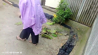 Girl Sweeping the Yard Naked in the Rain - Outdoor Scene