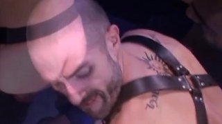David has a massive uncut cock for Nicolas to worship. Nicolas licks up and down David's leather joc
