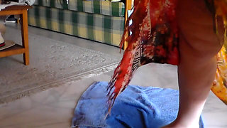 Jen is peeing on a towel in the livingroom